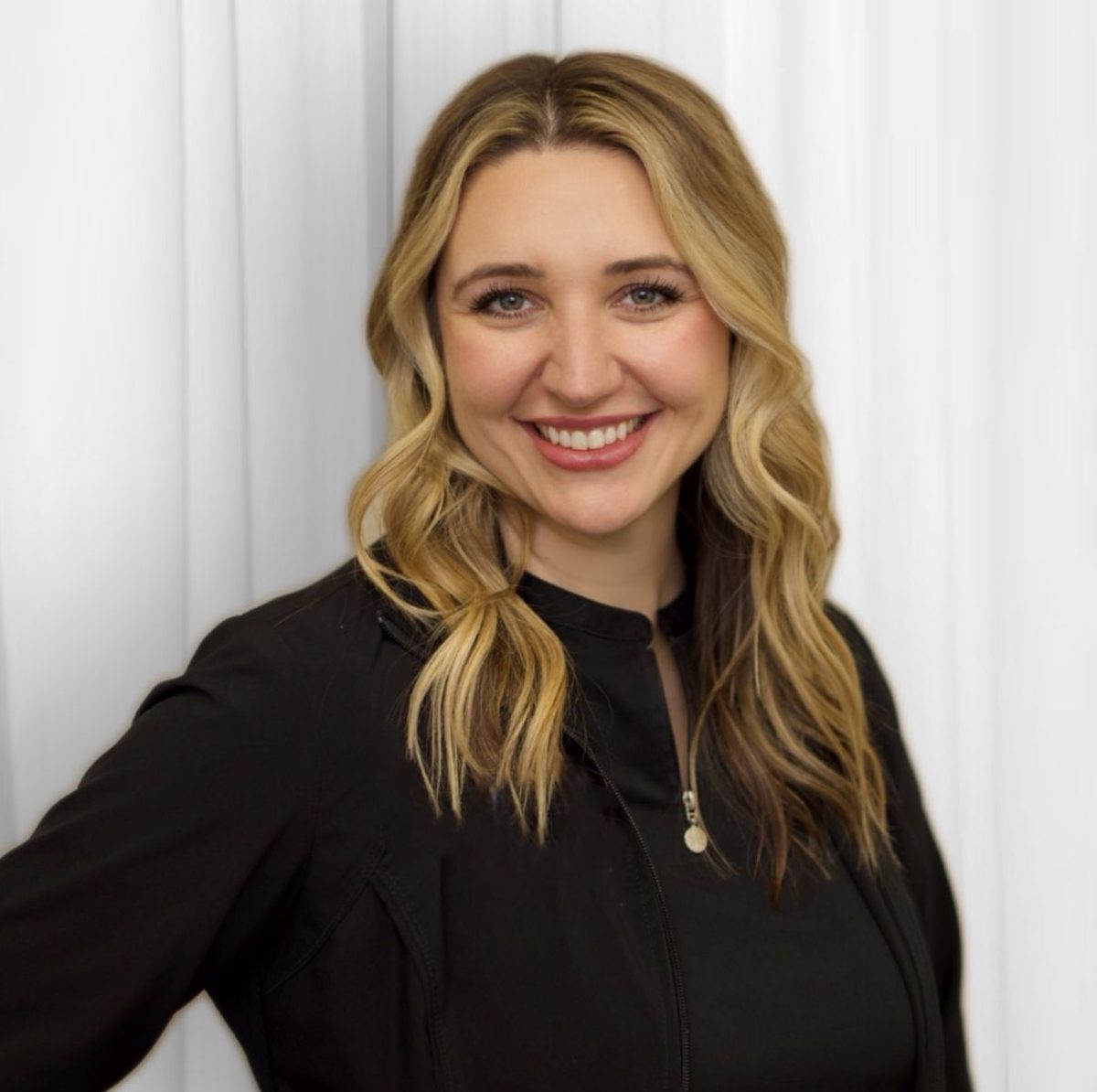 Dr. Elana York, DDS, smiling in a studio portrait