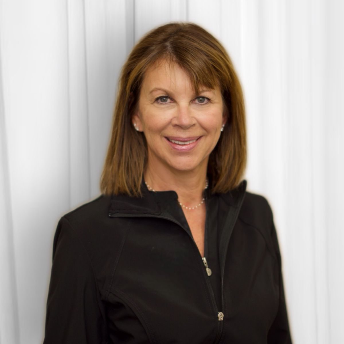 Dr. Nathalie Tungesvik, DDS, smiling in a studio portrait